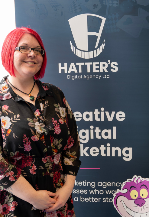 Sarah in front of Hatter's Banner